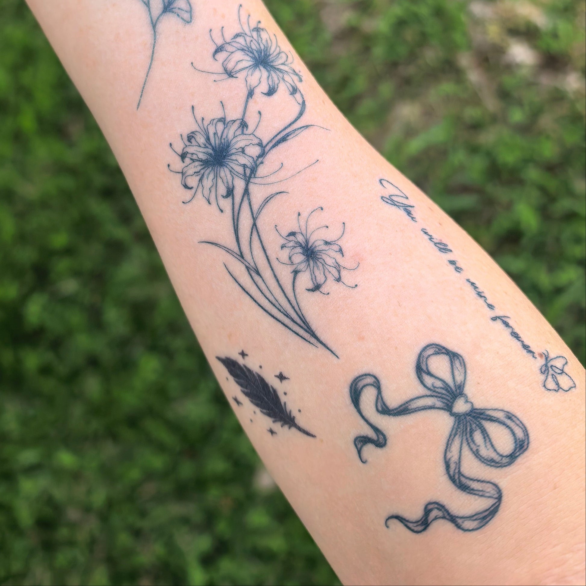 Cupid’s Bow temporary tattoo on wrist — Alter Ego Ink elegant ribbon tattoo