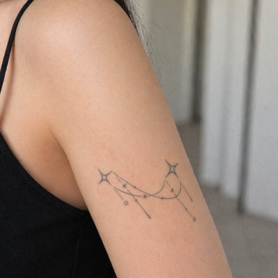 Celestial star temporary tattoo on wrist — Alter Ego Ink lasts 2 weeks