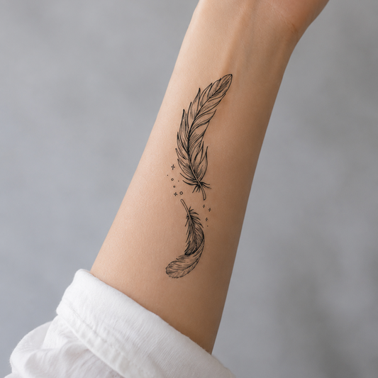 Drifting Feathers fine line temporary tattoo design featuring two floating feathers with delicate star accents.