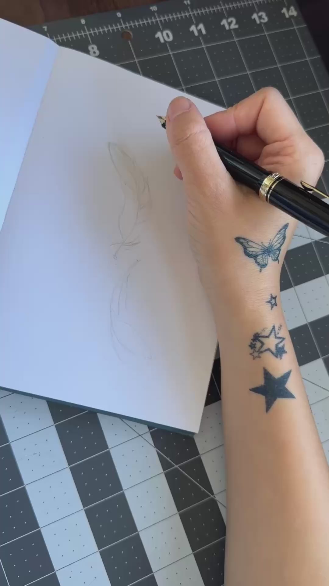 Hand-drawn Twin Feathers fine line temporary tattoo design featuring two elegant floating feathers.