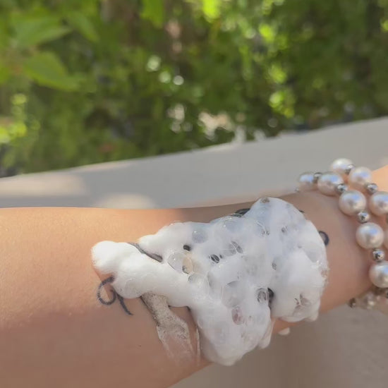 Temporary tattoo waterproof durability test on wrist with soap foam — Alter Ego Ink script tattoo design