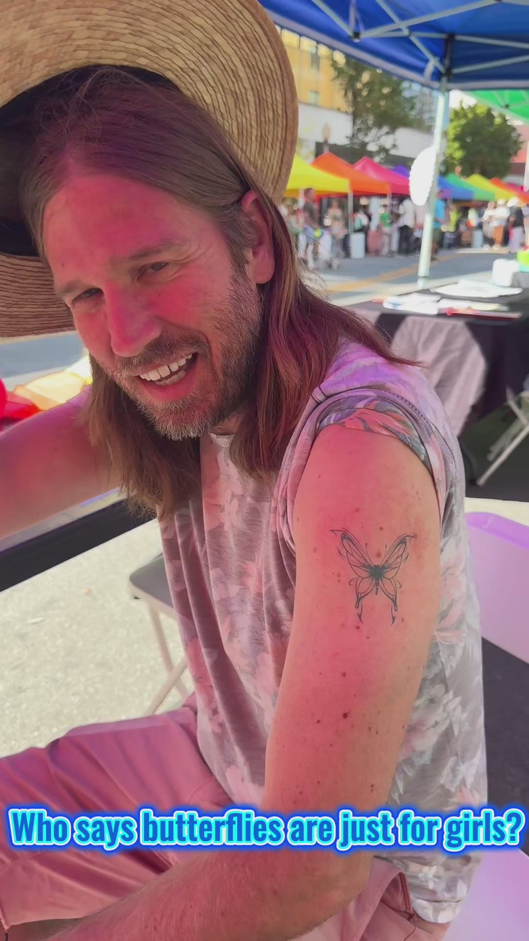Close-up video of a realistic butterfly temporary tattoo applied on a man’s arm and a woman’s forearm using water-free temporary tattoo technology