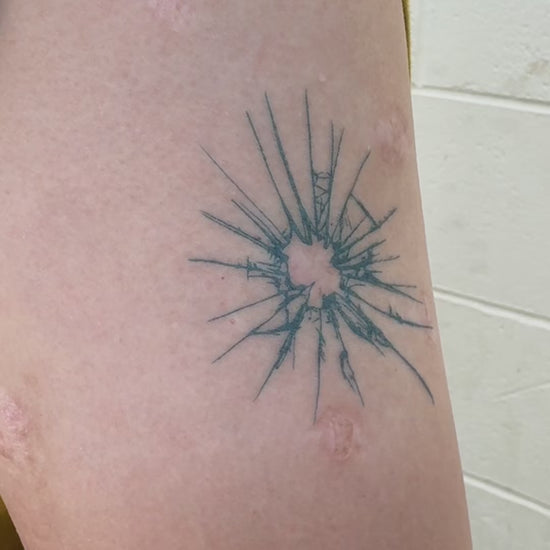 Before and after showing the Breaking Point temporary tattoo transforming a healed scar into fine line body art