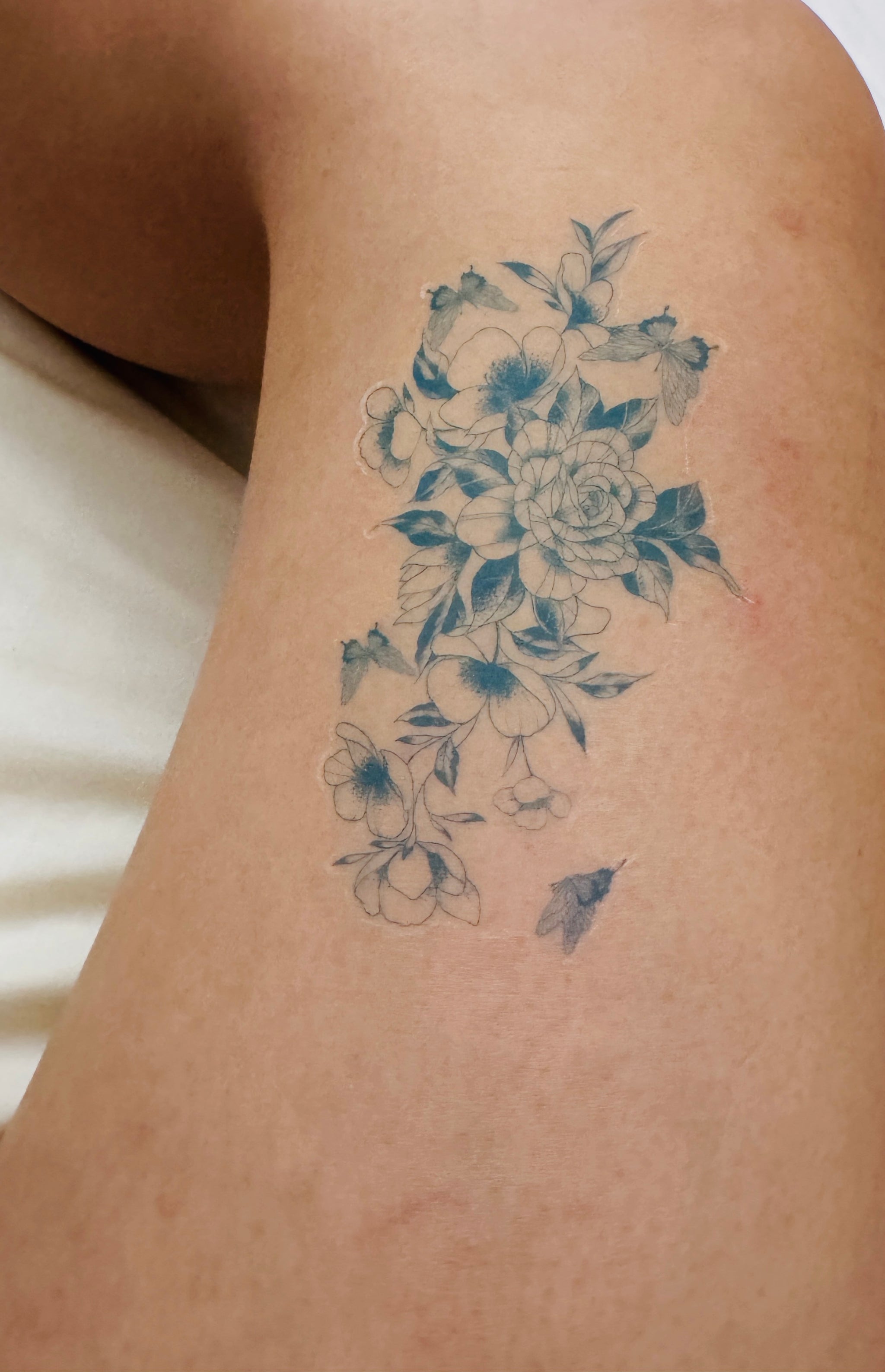 the Secret Garden realistic temporary tattoo, showcasing a waterproof fine-line floral tattoo design after swimming