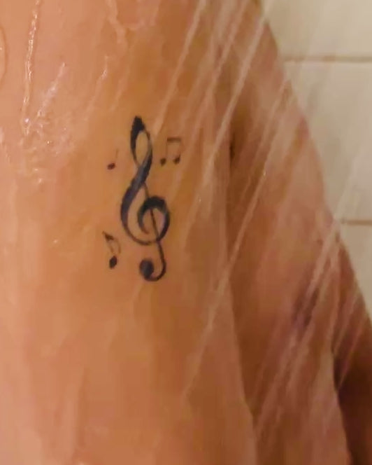 Melody With You temporary tattoo final look video — Alter Ego Ink fine line music note real tattoo look