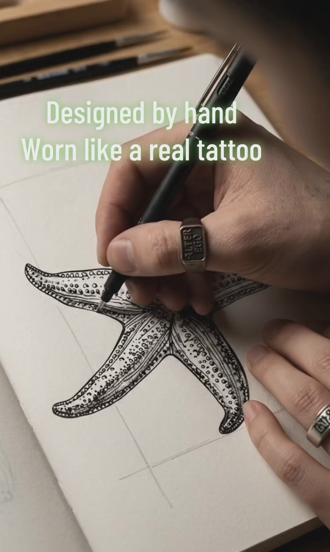 Starfish temporary tattoo design-to-skin application video — Alter Ego Ink fine line ocean real tattoo look